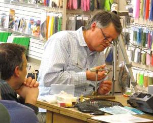 Master fly tier Skip Morris performing a fly tying demonstration