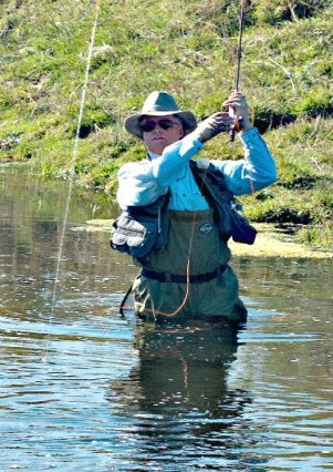 Skip Morris fighting a big rainbow trout on Crab Creek, eastern Washington state