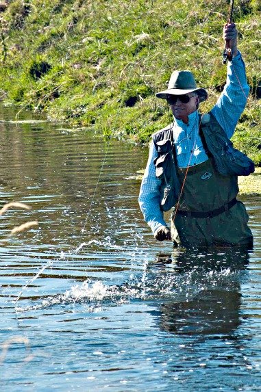 Author Skip Morris fighting a fiesty Crab Creek rainbow trout in eastern Washington state